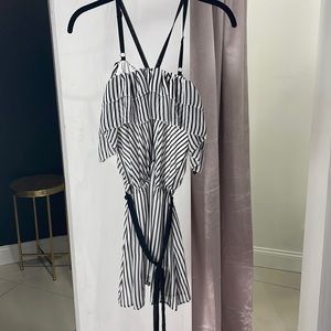 Black and white striped romper-ruffles-adjustable strap detail